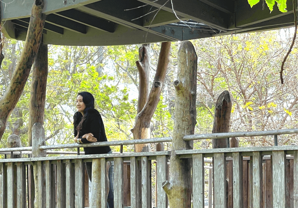 A woman staring into the distance and searching for a higher purpose in life.